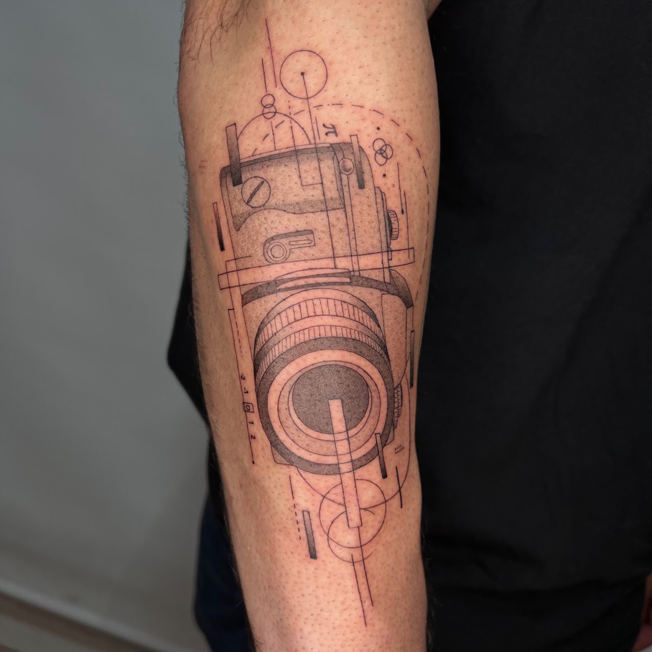 Fine line realist pet portrait tattoo by Caos Art Tattoo